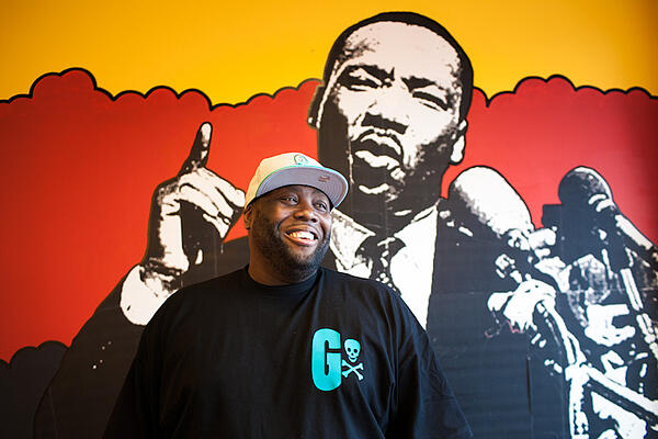 Killer Mike portraits in his barbershop graffiti swag shop